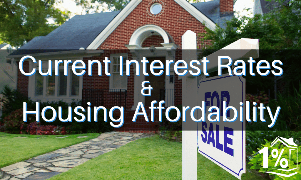 A quaint home with a for sale sign in the yard.